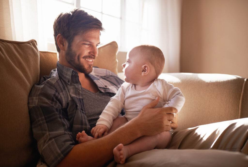 Cropped shot of an affectionate father bonding with his baby girl at home